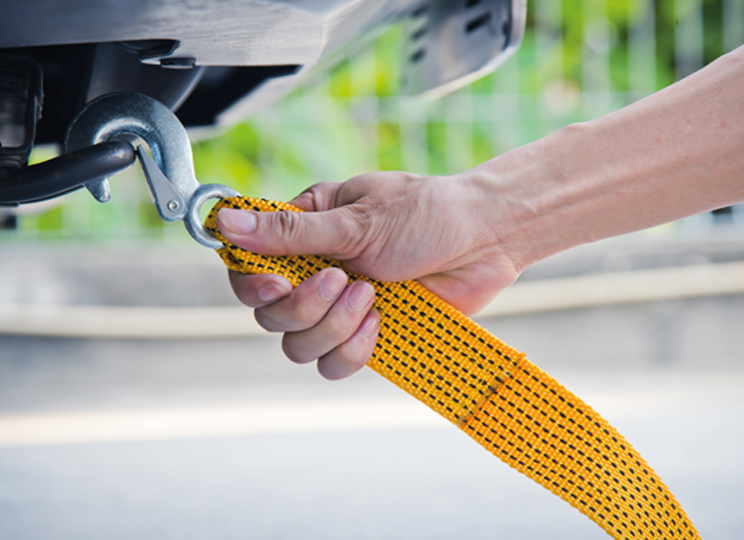Picture of a hand attaching a tow rope